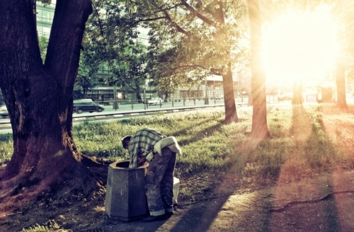 A man digging through a trash can: A parable of role reversals.