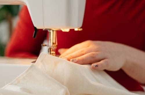 Using a sewing machine: Gifted As Artisans